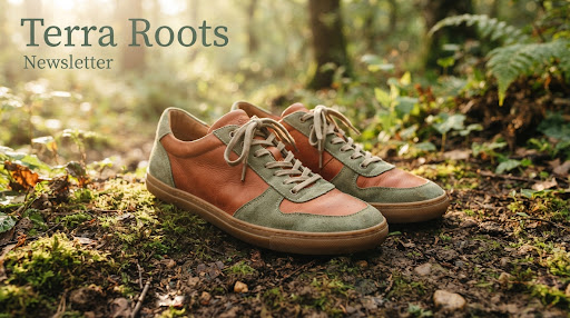 A close-up shot of mindful natural footwear resting on warm soil and moss, bathed in soft golden morning sunlight, earthy terracotta and sage greens, sustainable leather textures
