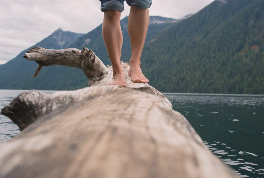 barefoot on log